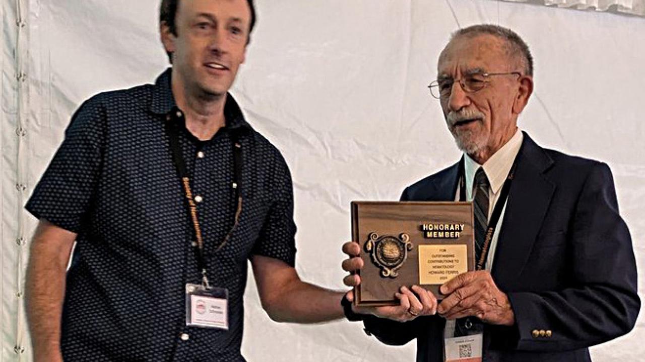 UC Davis Distinguished Emeritus Professor Howard Ferris (right) receives his Honorary Member award at the Society of Nematologists' meeting. With him is awards presenter Nathaniel Schroeder of Crops Science, University of Illinois, Urbana-Champaign. (SON Photo)