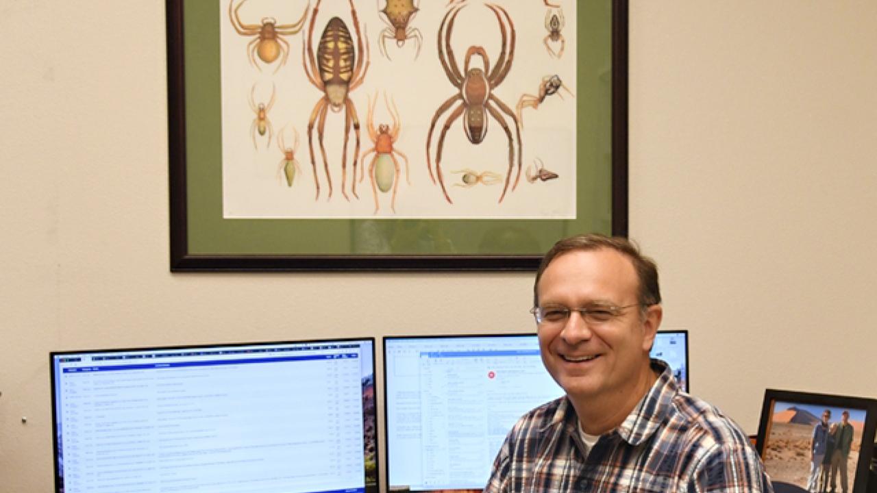 Professor Jason Bond pictured in his office in 2018, when he joined the UC Davis faculty. (Photo by Kathy Keatley Garvey)