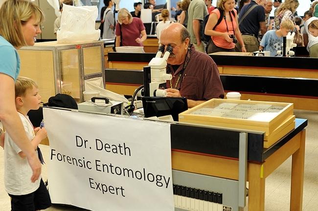 Forensic entomologist Robert Kimsey answers questions from is "Dr. Death" booth at UC Davis Picnic Day. UC