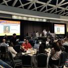 An image of UC Davis doctoral student CC Edwards is flashed on the screen at the American Mosquito Control Association Conference