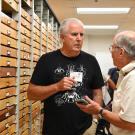 Jeff Smith (left) curator of the Lepidoptera collection at the Bohart Museum of Entomology, chats with Larry Snyder of Davis. (Photo by Kathy Keatley Garvey)