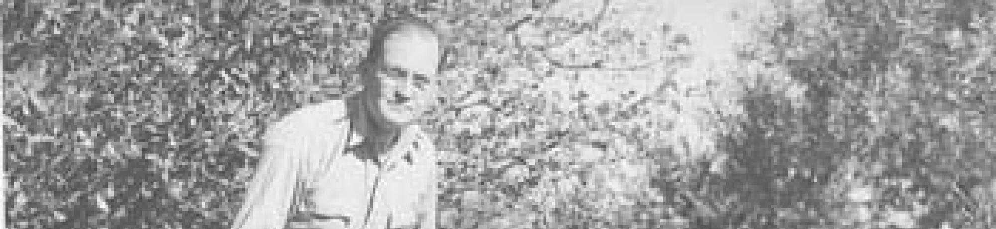 Harry H. Laidlaw Jr. with honey bees.